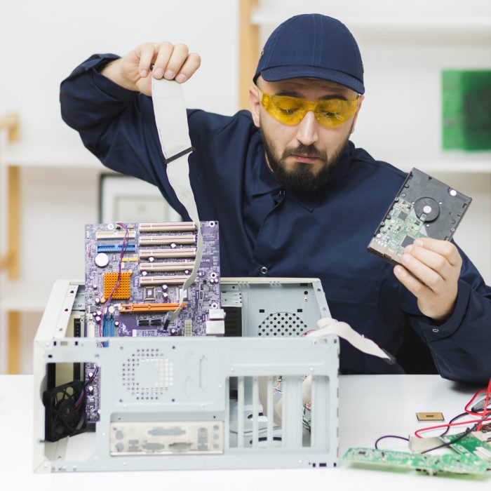front-view-man-repairing-computer front-view-man-repairing-computer